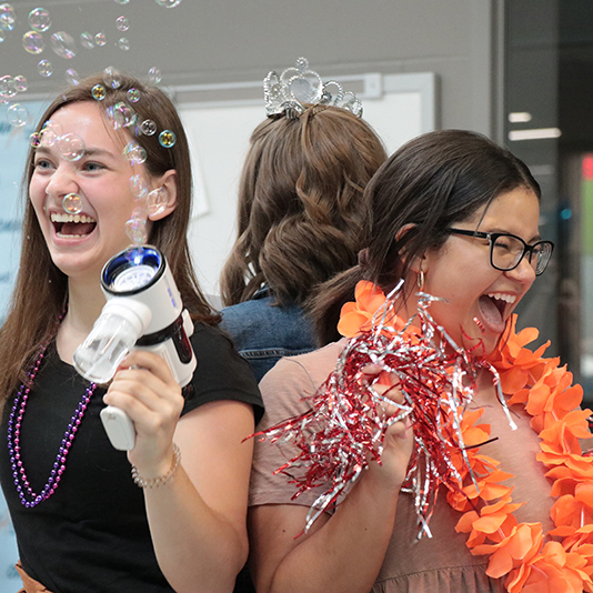  Teachers playing with bubbles and pom poms